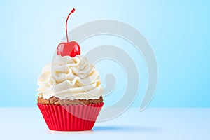 Cupcake. Birthday cupcake with cherry on top. Red cup liners. Happy Birthday. Tasty baking cupcakes, cake or muffin