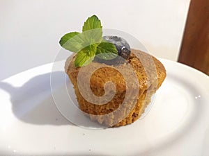 Cupcake of blueberry with mint