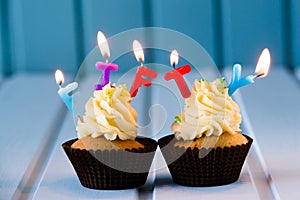 Cupcake with a candles for 50 - fiftieth birthday