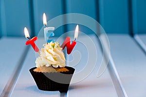 Cupcake with a candles for 10 - tenth birthday