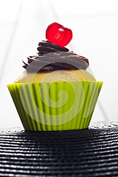Cupcake with cherry.
