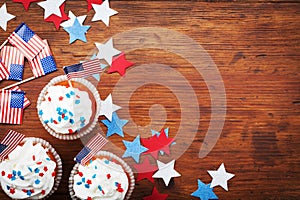 Cupcake decorated with american flag for happy Independence Day 4th july background. Holidays table top view.