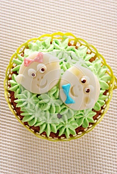 Cupcake decorated with baby faces