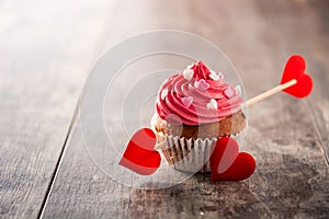 Cupcake decorated with sugar hearts for Valentine`s Day