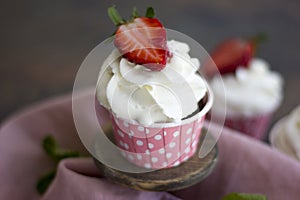 Cupcake with fresh strawberries.