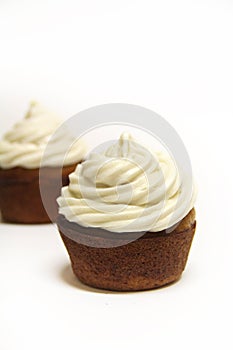 Cupcake frosted on white vertical