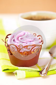 Cupcake with lavender icing top in festive wrap