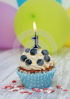 Cupcake with a numeral one candle