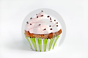 Cupcake with pink cream icing, on white background