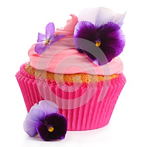 Cupcake with pink cream and violets