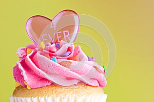 Cupcake with pink frosting and heart