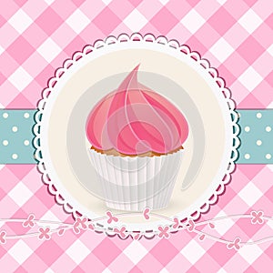 Cupcake with pink icing on pink gingham background