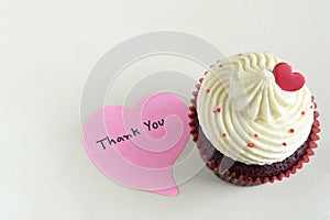 Cupcake with red heart and thank you massage