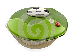 Cupcake with soccer bal isolated over white photo