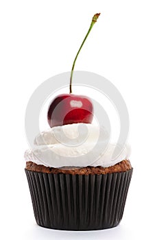 Cupcake with whipped cream and cherry