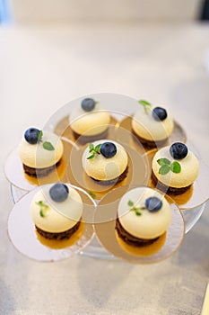 Cupcakes with blueberry on banquet table. Wedding table setting.