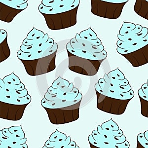 Cupcakes with chocolate sprinkles isolated. Blue background. Sweet Dessert with cream. Seamless pattern.Vector