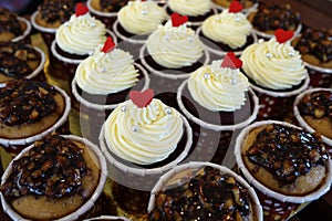 Cupcakes with cream cheese frosting and a red heart