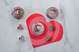 Cupcakes decorated with sugar hearts for Valentine`s Day