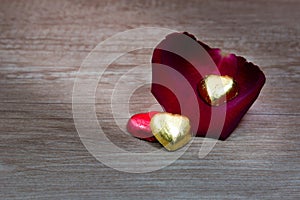 A cupcakes with heart shape chocolate on wooden table