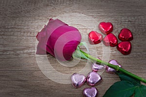 A cupcakes with heart shape chocolate on wooden table