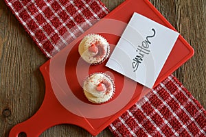 Cupcakes and loving sentiment on a wood background