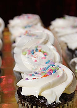 Cupcakes with Sprinkles on Table at Birthday Party