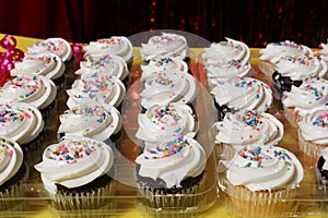 Cupcakes with Sprinkles on Table at Birthday Party