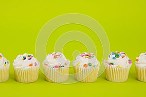 Cupcakes on yellow background