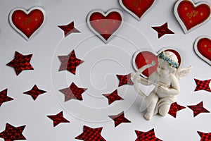 Cupid love symbol surrounded by red hearts