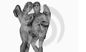 Cupid and Psyche. An ancient stone statue against white background