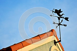 Cupid Weathercock Atop Roof photo