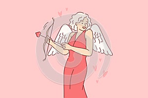 Cupid woman dressed up with wings for valentine day, uses with arrow and bow to seduce boyfriend