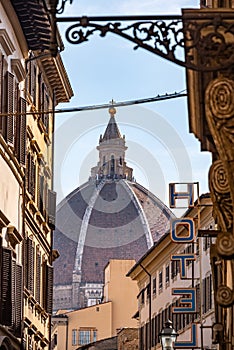 Cupola of the cathedral Santa Maria del Fiore in Florence, seen from a street far away