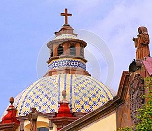 Cupola and sculpture, church in queretaro city, mexico.