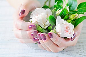 Cupped hands with manicured fingernails