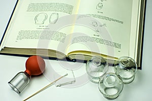 Cupping glasses with textbook