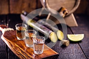 Cups of cachaÃ§a, a Brazilian drink made from sugar cane, a Brazilian run popularly called