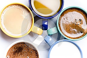 Cups of coffee, milk, juice, cappuccino. Isolated on a white background. Colorful cups. Glasses placed in a circle. Energy