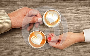 Cups of coffee on table