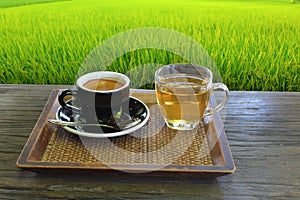 Cups of coffee and tea on table