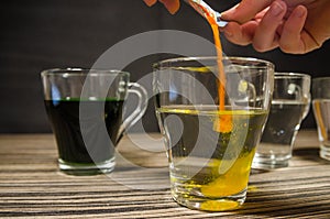 Cups with colored water for easter