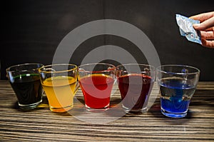 Cups with colored water for easter