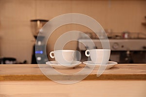 Cups of fresh aromatic coffee on table