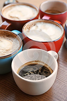 Cups of fresh aromatic coffee on table