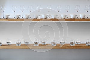 Cups and glasses on a shelf