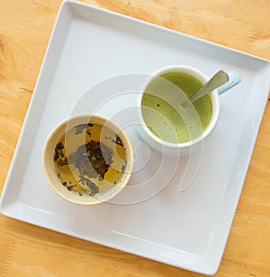 A cups of green tea on wood table background