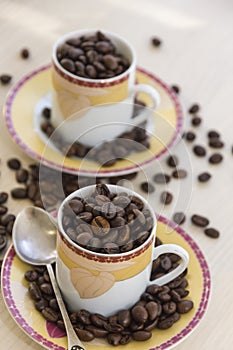 Cups with sauteed coffee beans.