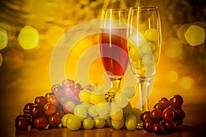 Cups of wine with grapes on a table