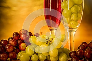 Cups of wine with grapes on a table